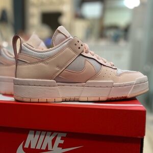 Women’s pink Nike dunk lows